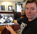 LES Close and the photo of him taking a surprise swing at iconic Muhammad Ali.