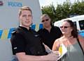 Mobile Police Station at Tesco, Oldham. Special Sergeant Benjamin Howarth talks to locals Nick Dobbs and Jean Dobbs