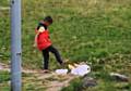 Video still of a boy kicking litter at Dovestone Reservoir recently.