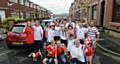 Friendly Euro 2016 rivalry between England and Wales on Wales Street, Watersheddings. Pic shows some of the football-mad residents including front row left to right, Diesel the dog, Amelia Cunningham (8), Welshman Chris Cunningham, Liam Farrand (8), Englishman Chris Farrand, Lacey Johnson (8).