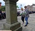 HONOUR . . . Megan Ames and Mitchell Scott, last year's head boy and head girl lay a wreath