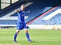 POINTING THE WAY . . . experienced defender Peter Clarke made his Athletic debut last night