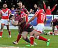 NO STOPPING ME . . . Liam Thompson shows grit and determination to notch the Roughyeds' third try 