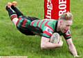 FLYING LOW . . . Nathan Jewitt scores a try for the Warriors as they trounce Castleford Panthers