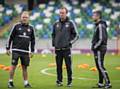 IN THE HOT SEAT? . . . Steve Robinson (right) with Northern Ireland manager Michael O'Neill (centre) and kit manager Colin McGiggert at Windsor Park, Belfast.