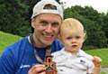 Matt Longbottom shows off his medal to son Harry (1)