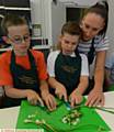 CHOPPING the veg . . . Lewis Pheasey, Harvey Gibson (both 9), and Harvey's mum Susan