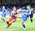 CLOSE CONTROL . . . Athletic midfielder Ryan Flynn brings down the ball under pressure from a Walsall rival
