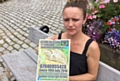 HAYLEY Broxup with her wanted posters for missing tortoise Clyde, who disappeared from Saddleworth a month ago
