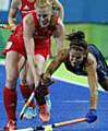 Nicola White sends a United States player crashing to the ground in the group stages