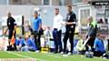 ATHLETIC boss Stephen Robinson (white shirt) and Ian Baraclough (right) watch events unfold