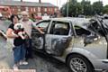 ELLISON and Edna Thomas with their dog Belle next to their wrecked car. Picture by ANTHONY MILLER
