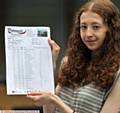 TRIUMPH out of grief . . . Megan Moorhouse  with her pass paper