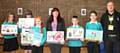 COUNCILLOR Diane Williamson and Mark Greenhalgh with Royton & Crompton pupils including winner Gracie (third from left)