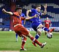 CHARGE DOWN . . . Billy Mckay tries to block a Carlisle clearance. PICTURES by ALAN HOWARTH