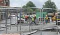 PACKING up . . . workmen clear the former Shaw market site