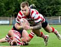 DEBUT TRY . . . Scott Turner gets through the Workington line to score.