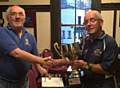 TROPHY TIME . . . Hollinwood's Fred Halliwell (left) with Oldham Amateur League secretary Phil Bradbury