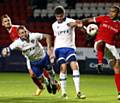 HEAD TURNER . . . inspirational skipper Peter Clarke nets Athletic's equaliser in the Sky Bet League One clash against Charlton last night

