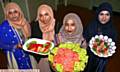 FEAST . . . from the left, Nasima Begum, Parul Begum, Fardusi Rahman, Shah Gharna Begum, with food that was sold at the fundraiser to raise funds for the Al-Khair charity