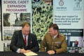 Headteacher Neil Hutchinson with Colonel Phil Harrison as they sign the Armed Forces Covenant for Royton and Crompton School