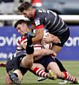 Liam Thompson of Oldham is held during the Kingstone Press Championship game