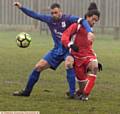 GETTING STUCK IN . . . Crown's Andy Walker (left) and Springhead Libs' Daniel Gordon