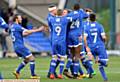 JOSH JOY...Josh Law is mobbed by his team-mates after putting Athletic in front - but he is released