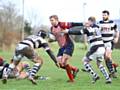 DETERMINATION...Oldham's Gareth Blomeley charges towards the Trafford MV line