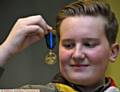 SCOUT hero . . . Ethan Curley admires his medal