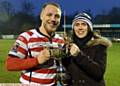 ALL YOURS...Scott Leatherbarrow receives the Oldham Rugby League Heritage Trust trophy from Jenny Turner