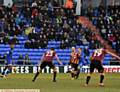 IT'S THERE . . . Brian Wilson (slightly obscured) scores what turned out to be Latics' consolation goal against Bradford.