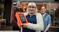 LINDA Oakes (centre) with shop manager Carol Forshaw and (right) volunteer Zoe Halliwell