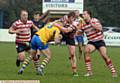 HOLDING ON: new Oldham RL captain Gareth Owen tries to halt a Swinton Lions attack