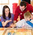 Juan Mata with pupil Liam Lambert and teaching assistant Jill Lomax