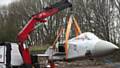 EASY does it . . . the Tornado is lifted into place at the new firefighter centre