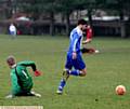 NEAT FEAT . . . Danny McLoughlin rounds the Shelley goalkeeper before putting Diggle ahead