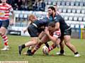 LOST BALL . . . Adam Neal can't manage to cling on to possession for Oldham