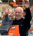 GRATEFUL . . . Little Millie Moran with Alan Wrigley at B&Q Oldham