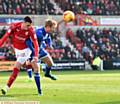 SURVIVAL BELIEF . . . Chris Taylor gets stuck in during last weekend's gritty goalless draw at Swindon