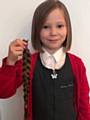 Gracey Macdonald shows off her new hairstyle after having her long locks cut off and donated to the Little Princess Trust