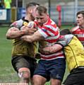 HELD UP . . . Oldham forward Danny Langtree