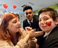 FACE-PAINTING . . . Teacher Lonya Burns with pupils Jahan Uddin (left) and Alex Pokuta at Red Nose Day at the Oldham Academy North