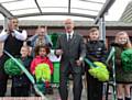 OPEN . . . Sir Bobby Charlton (centre) cuts the ribbon at Woodlands Primary Academy with (from left) acting head teacher Phil Sharrock, Tyler Carnegie, Lady Norma Charlton, India Cudjoe, Brayden Watson and Evaaney Eaves
