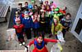 Crompton Primary School, Crompton take part in the Great British Spring Clean Litter Heroes. Pictured here (front) leading the way is Indiya Rowe (5) with fellow pupils all dressed as superheroes.
