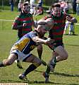 KNEES UP . . . Waterhead's Dale Lowe tries make a break. 
