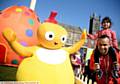 HIGH fives . . . Sophia Ali (three) with dad Joynul Ali meet Chickedy from the Twirlywoos in Parliament Square