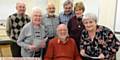 JOHN FIDLER (seated, centre) takes his 600th lesson at the Oldham Local History Community Group