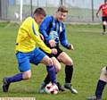 GETTING STUCK IN . . . Royton Athletic's Paul Badby and Horseshoe's Adam Carr.  PICTURES by TIM BRADLEY