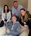 OFF the streets . . . Phil in his new home with (from left) Debbie White, Gary Curley and Amanda Wood